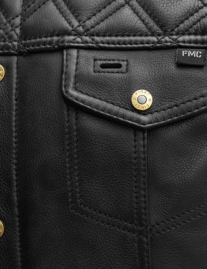 Close-up of a black leather jacket with gold buttons and 'FMC' branding.