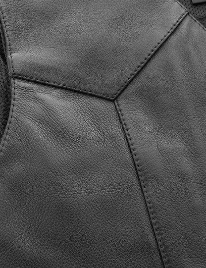 Close-up of a black leather jacket with stitching detail