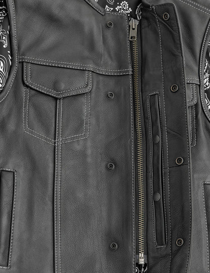 Close-up of a gray leather jacket with patches and zippers