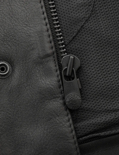 Close-up of a zipper on a textured surface