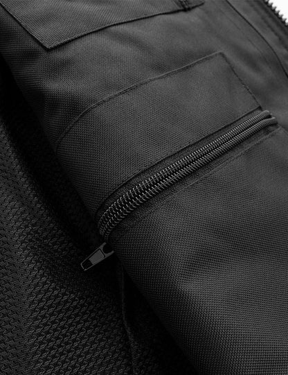 Close-up of a black jacket with a zipper pocket
